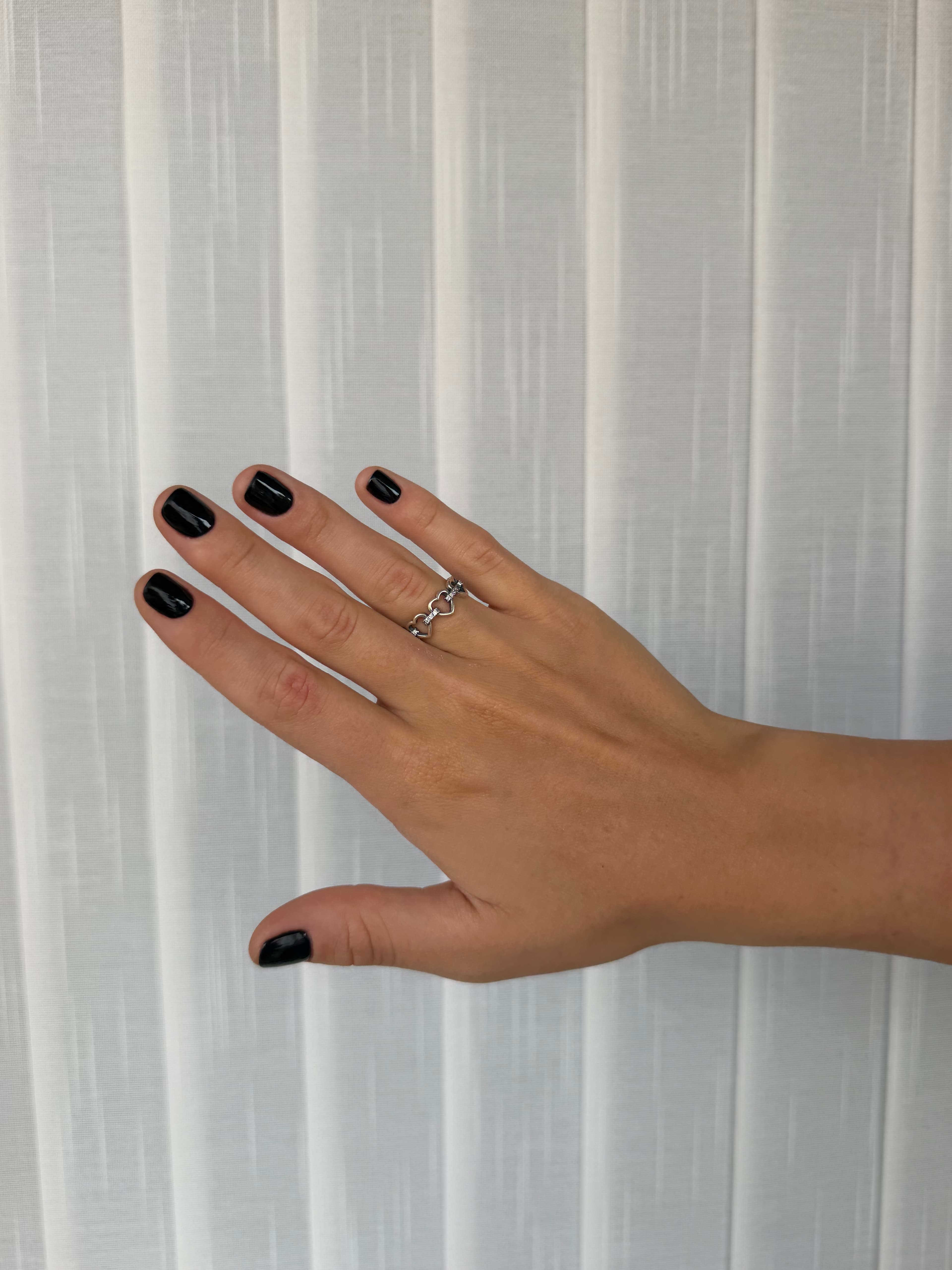 Anillo corazones entrelazados